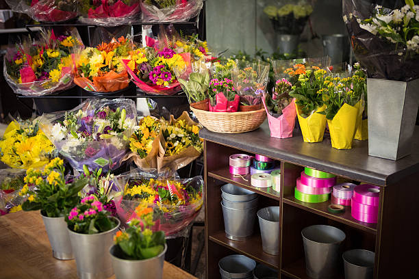 Flower vase arranged on a wooden worktop at flower shop