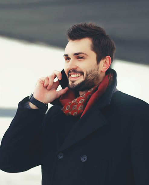 istock Portrait handsome bearded smiling man talking on smartphone walk 602336224