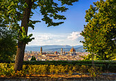 Florence or Firenze sunset aerial cityscape from a public garden