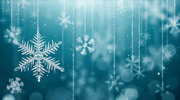 istock Macro Snowflake and Fallen Defocused Snowflakes 602336692