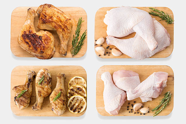 Mockup raw chicken and grilled chicken on cutting board set. Mockup raw chicken and grilled chicken on cutting board set isolated on white background. Clipping Path included isolated on white background. chicken leg stock pictures, royalty-free photos & images