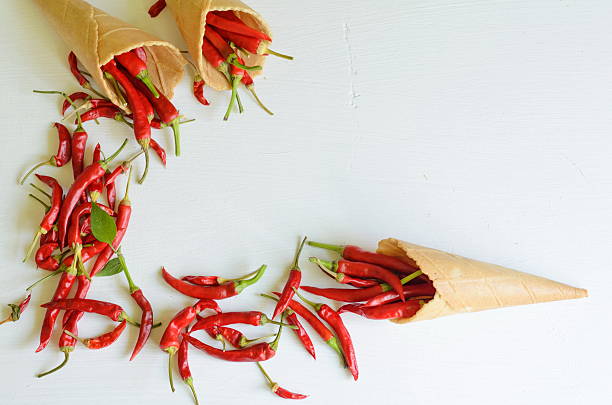 istock Red hot chili peppers in sugar waffle cones 602338288