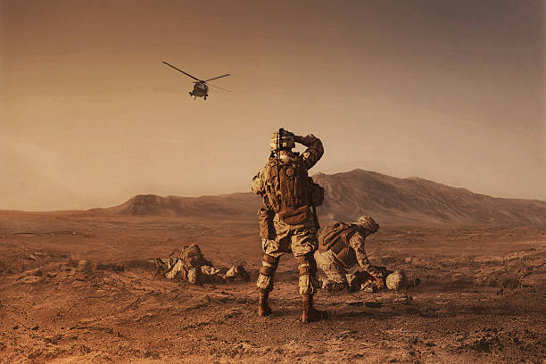 waiting for medevac bird Squad of US marines waiting for medevac bird physical injury photos stock pictures, royalty-free photos & images