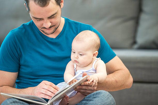 istock Looking at a Picture Book Together 603151428