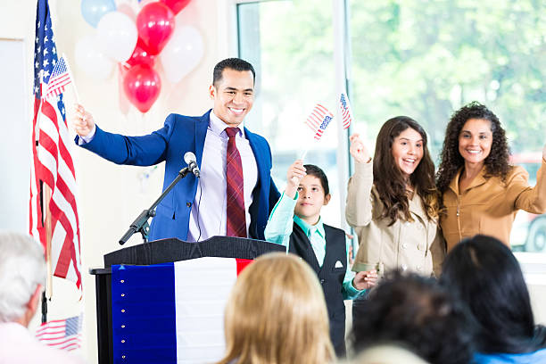 istock Hispanic candidate giving speech while family supports him 603151450