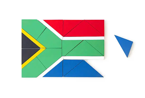 Photo of South African flag made from wooden puzzle pieces