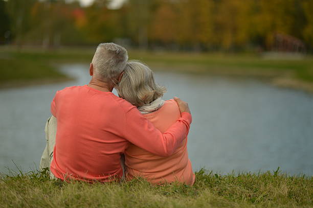 istock Happy senior couple  near river 603152530