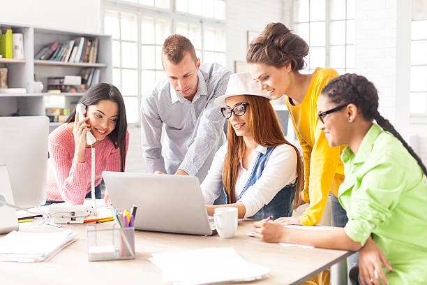 istock Group of young people working at modern workplace 603155812