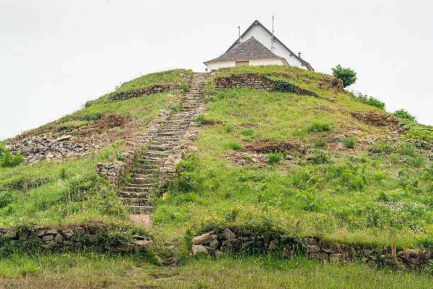 Saint-Michel tumulus megalithic grave mound named Saint-Michel tumulus near Carnac, a commune in the Morbihan department of Brittany, France burial mound photos stock pictures, royalty-free photos & images