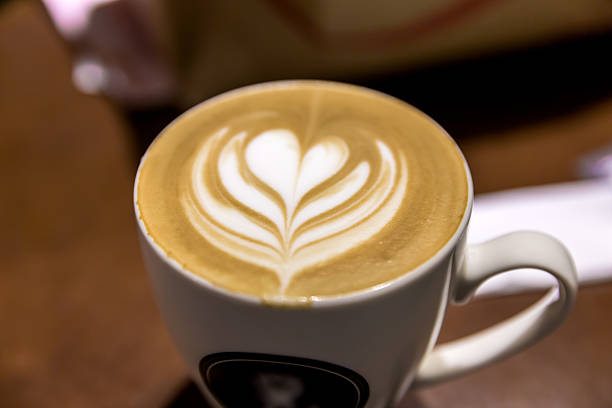 istock Hot cuppuccino with art print 603157720