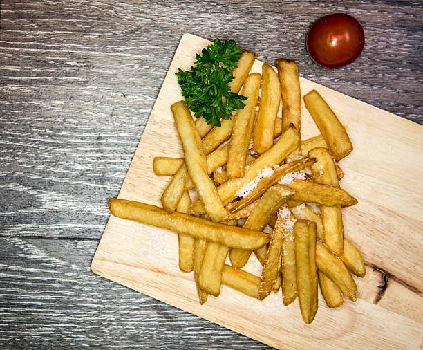 istock French fries on a wooden background 603160444