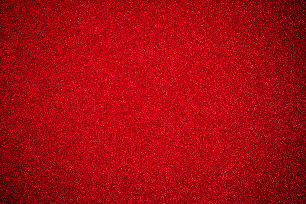 istock close up red glitter paper background 603160812
