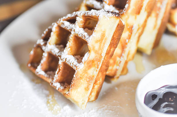 istock waffles with icing sugar and blueberry dip 603160984