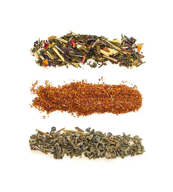 Three Strips of loose green, rooibos and mixed tea made from rose petals, lemongrass, white and green tea, almonds, orange pieces and cinnamon