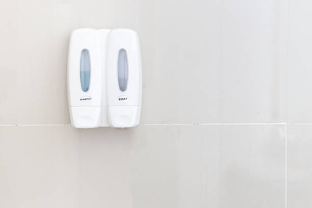 istock Shampoo and soap bottle on bathroom wall 603163722