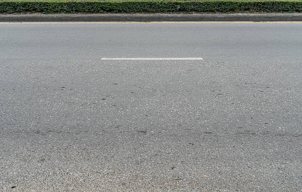 istock Asphalt road with concrete curb 603165684