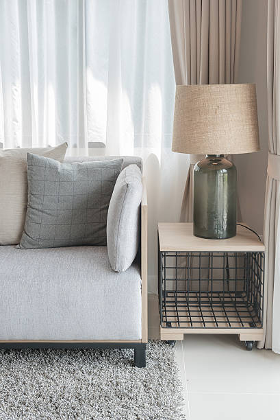 istock modern grey sofa with pillows and modern lamp 603165726