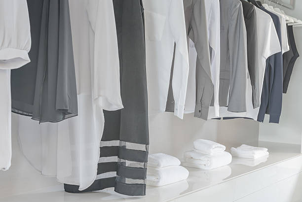 istock black and white color tone clothes hanging on rail 603166380