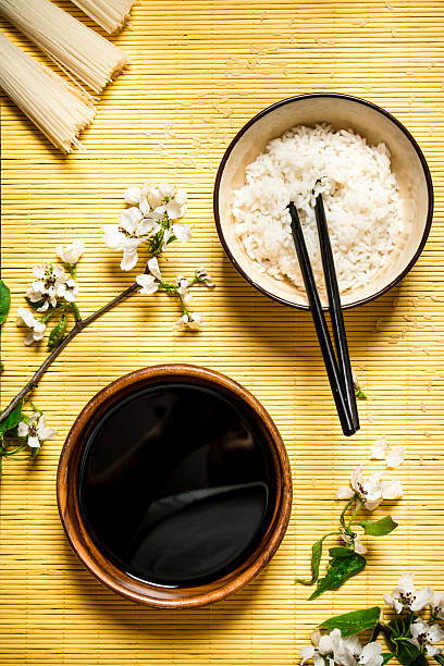 istock Boiled rice with soy sauce and the cherry branches 603169610