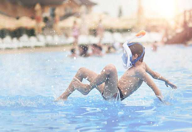 istock jump in the water 603171554