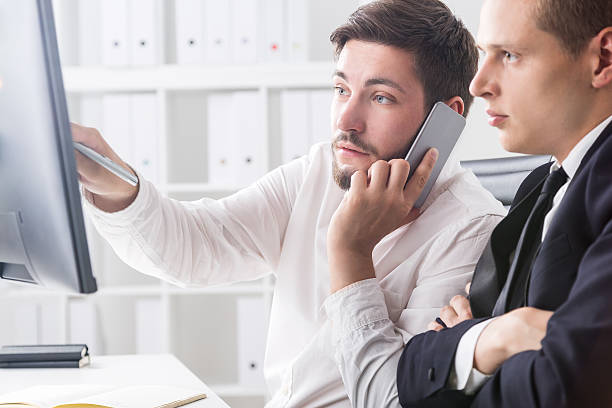 istock Colleagues working in company office 603173710