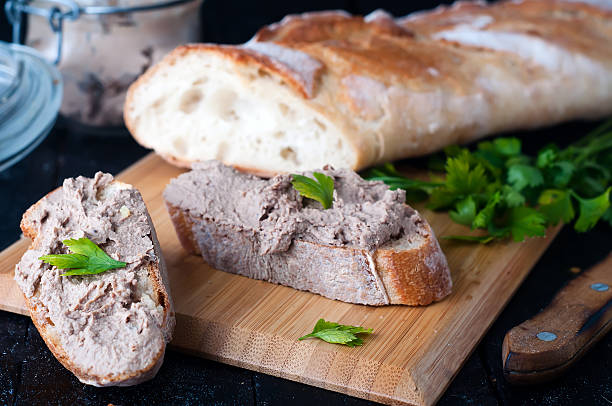 istock mousse, pate in a jar with baguette and parsley 603174270