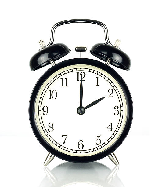 istock Alarm Clock isolated on white, showing two o'clock. 603174892