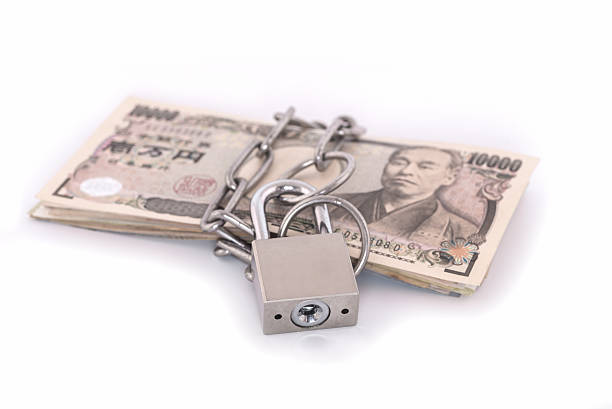 istock Yen bank notes with a lock and chain 603175180