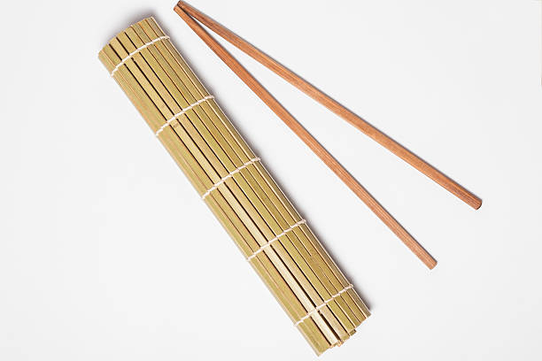 istock sushi bamboo mat with chopsticks on white background 603178010