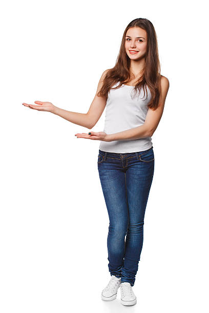 istock Smiling woman showing open hand palm with copy space 603179310