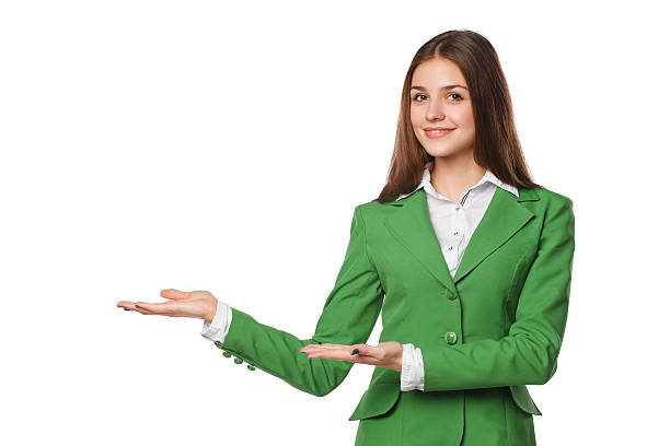 istock Smiling business woman showing open hand palm with copy space 603179696