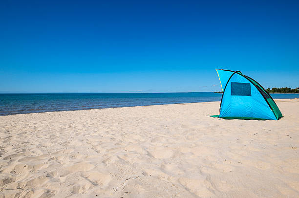 istock Colorful Tent or Solar Shade on a Sandy Beach 603180306