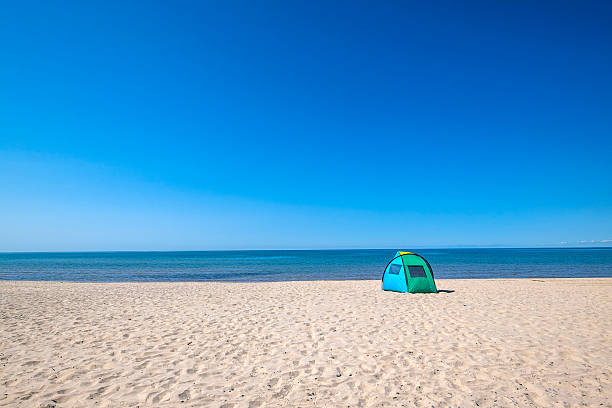 istock Colorful Tent or Solar Shade on a Sandy Beach 603180384