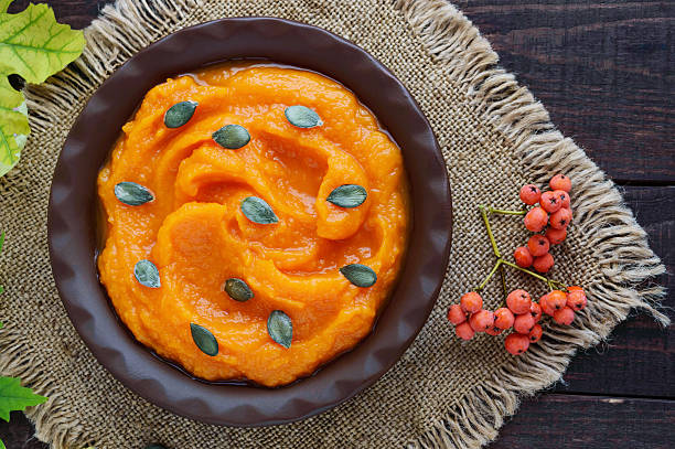 istock Organic pumpkin puree in a clay bowl. Dietary dish. 603180636