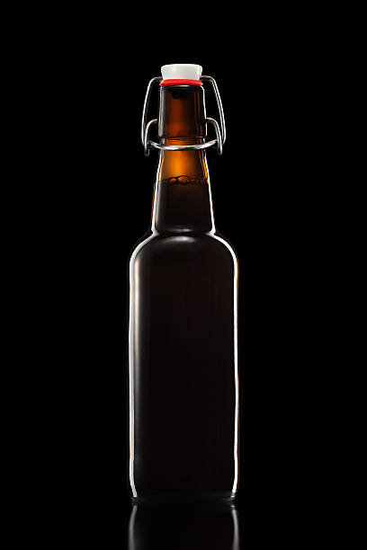 istock Swing top bottle of light beer isolated on black background 603180784