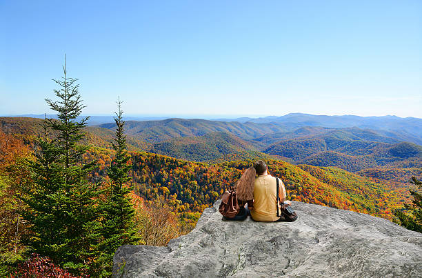 istock Couple on hiking trip enjoying mountain view. 603181450