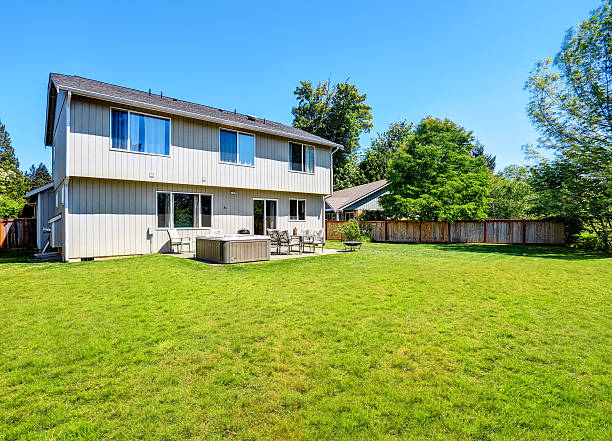 istock Backyard concrete floor patio area with hot tub. 603182376