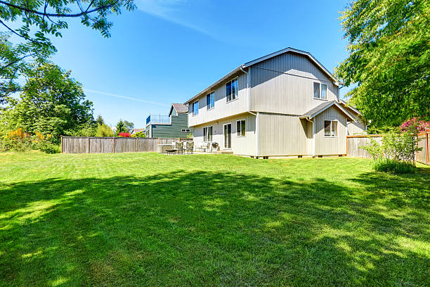 istock Backyard concrete floor patio area with hot tub. 603182690