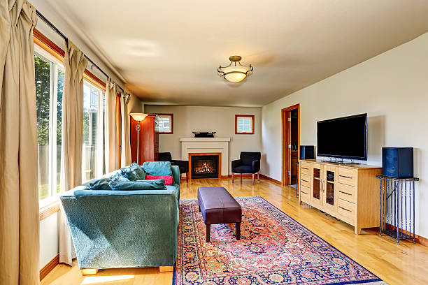 istock Traditional living room interior with fireplace and rug. 603183056