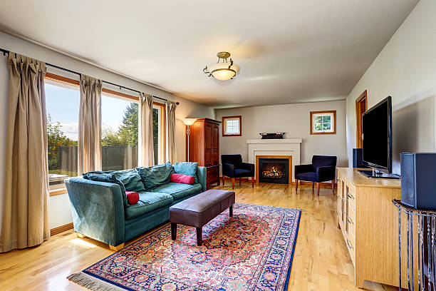 istock Traditional living room interior with fireplace and rug. 603183104