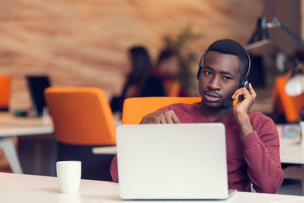 istock Customer Service agent in an startup office with laptop 603183646