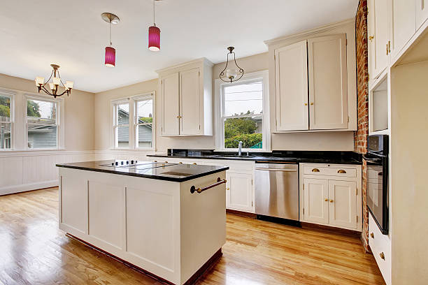 istock Classic kitchen room interior with white cabinets ,dark counter top. 603183654