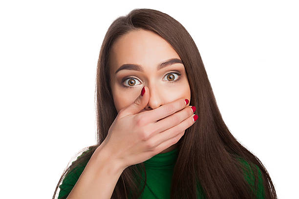 Woman in a green turtleneck Woman in a green turtleneck showing emotions and feelingsBeautiful girl in a green turtleneck photographs selfieWoman in a green turtleneck showing emotions and feelingsBeautiful girl in a green turtleneck photographs selfie tooth in hand stock pictures, royalty-free photos & images