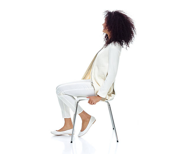 istock Cheerful woman sitting on chair 603185462