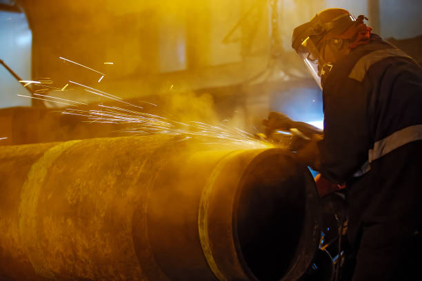 istock Sanding butt pipeline connection. Preparation of metal for welding. 603186290