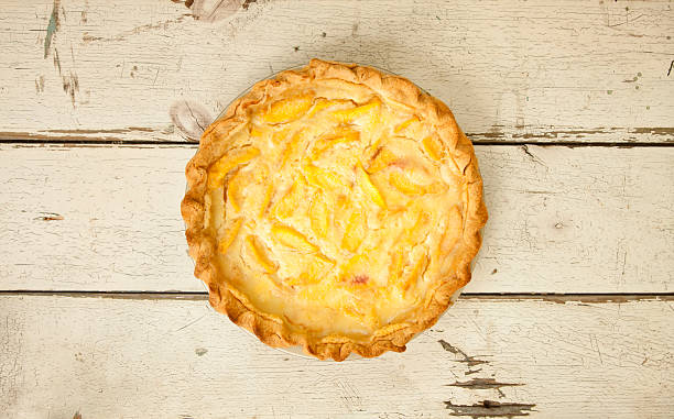 Peach Pie on Old White Wood Background