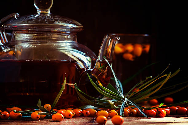 istock Glass teapot with tea with sea buckthorn 603187210