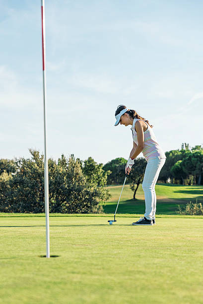 istock Woman golf player concentrating. 603192558