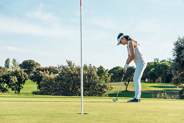 istock Woman golf player concentrating. 603192582