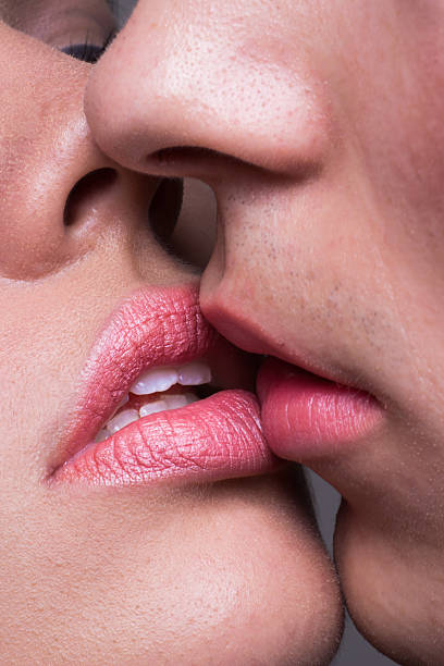 istock Close-up two lips kissing sensual intimate 603193738